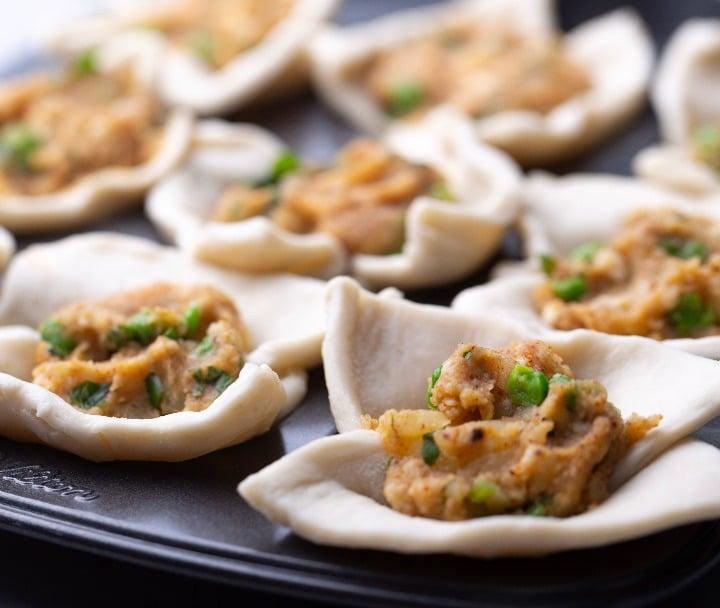 Add filing to the puff pastry bowls