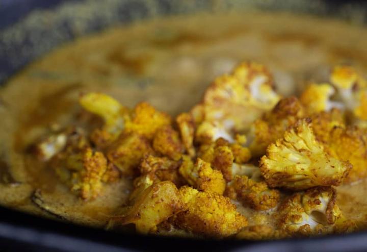 Add Roasted cauliflower and finish Rongi gobhi ka dum.